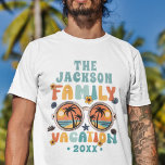 Retro palm trees sunglasses groovy family vacation T-Shirt<br><div class="desc">Get ready to groove in style with this customisable family vacation t-shirt! Embrace the sun-soaked vibes with a vibrant sunglasses illustration, accompanied by swaying palm trees. The caption "family vacation" pops in a colourful retro font, adding a touch of nostalgia to your getaway. Personalise it with your family name and...</div>