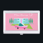 Retro Pink Palm Springs Business Card Holder<br><div class="desc">“palm Between the pink background, turquoise mid century modern home, and the classic 1950s car, this design couldn’t be more Palm Springs if it said it in the clouds. Oh, wait, it does say it in the clouds! The blue and teal stone of the house is offset by the sputnik...</div>