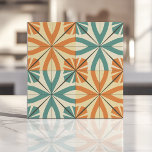 Retro Starburst Design in Teal and Terracotta Ceramic Tile<br><div class="desc">Bring bold retro vibes to your space with this striking starburst design. Featuring dynamic teal and terracotta orange patterns on a soft cream background, this geometric tile adds a playful and vibrant touch to any room. Perfect for backsplashes, accent walls, or mid-century modern-inspired interior designs, this versatile piece blends vintage...</div>
