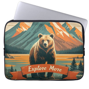 Retro-style bear cartoon and mountain range laptop sleeve