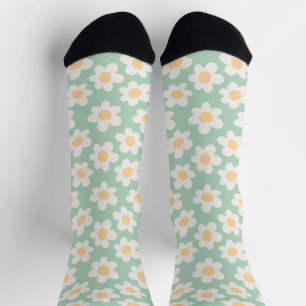Retro style daisies in bloom on green background socks