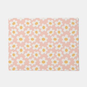 Retro style daisies in bloom on pink background doormat