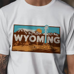 Retro Travel Iconic Wyoming Graphic T-Shirt<br><div class="desc">Celebrate the Equality State with this Retro Travel Iconic Wyoming Graphic T-Shirt. Featuring a vintage-inspired design that captures the unique charm and rugged beauty of Wyoming, this shirt is perfect for travelers and residents alike. Made from high-quality materials for a comfortable fit, it's ideal for casual outings, travel, and everyday...</div>