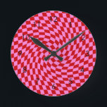 Retro Warped Red Pink Checks Chequered      Round Clock<br><div class="desc">Retro warped checks chequerboard design,  in red and pink combination. Retro chequerboard twirled seventies psychedelic style modern design home decor,  office,  and school products,  and retro warped chequered gifts.</div>