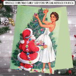 Retro Woman Santa Christmas Tree  Holiday Card<br><div class="desc">Step back in time with this delightful Retro Christmas Woman in White Holiday Card, capturing the joy and romance of the holiday season. Featuring a stylish woman decorating a Christmas with Santa. This mid-century inspired design evokes the glamour and fun of vintage holiday parties. The vibrant colours and nostalgic details...</div>