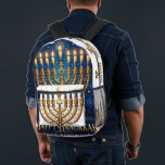 Rich Blue & Gold Jewelled Hanukkah  Printed Backpack<br><div class="desc">Celebrate the Festival of Lights in opulence with this beautifully designed rich blue and gold Hanukkah menorah holiday postcard! This flat postcard features a stunning, detailed illustration of an ornate, antique-style gold Hanukkah menorah, lavishly adorned with vibrant multi-coloured gems and delicate enamel work. The menorah is fully lit with nine...</div>