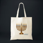 Rich Blue & Gold Jewelled Hanukkah  Tote Bag<br><div class="desc">Celebrate the Festival of Lights in opulence with this beautifully designed rich blue and gold Hanukkah menorah holiday postcard! This flat postcard features a stunning, detailed illustration of an ornate, antique-style gold Hanukkah menorah, lavishly adorned with vibrant multi-coloured gems and delicate enamel work. The menorah is fully lit with nine...</div>