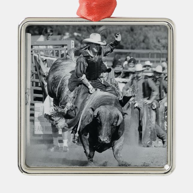 Rider hanging on to bucking bull metal ornament (Front)