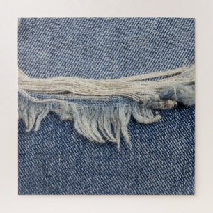 Ripped jeans texture, stylish background. jigsaw puzzle