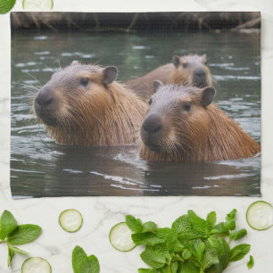 "River Serenity: Capybaras Swimming in the Flow" Tea Towel