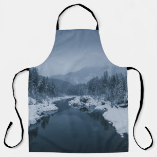 RIVER SURROUNDED BY SNOW COVERED FIELD WITH PINE T APRON