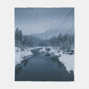 RIVER SURROUNDED BY SNOW COVERED FIELD WITH PINE T FLEECE BLANKET