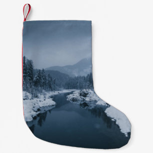 RIVER SURROUNDED BY SNOW COVERED FIELD WITH PINE T SMALL CHRISTMAS STOCKING
