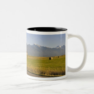 Road bicyclists ride down a back country road Two-Tone coffee mug