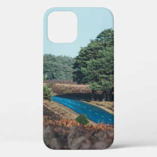 ROAD SURROUNDED WITH TREE DURING DAYTIME iPhone 12 CASE