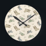 Roaring Art Deco Bi-planes - blue green pattern.   Round Clock<br><div class="desc">Fun tossed kids aviation pattern of hand-drawn bi-planes in 1920's Art Deco colors,  set on a solid cream background. This is a transparent pattern. You can change the background color and the size and position of the pattern. This design matches the Art Deco Bi-planes collection.</div>