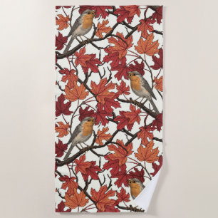 Robins in maple tree on off white beach towel