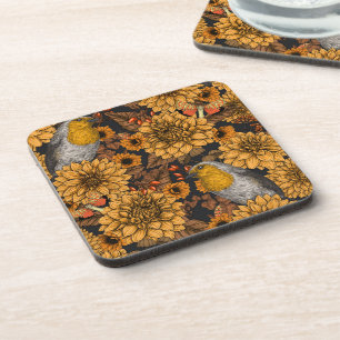 Robins in the autumn garden on black coaster