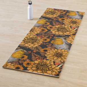 Robins in the autumn garden on black yoga mat
