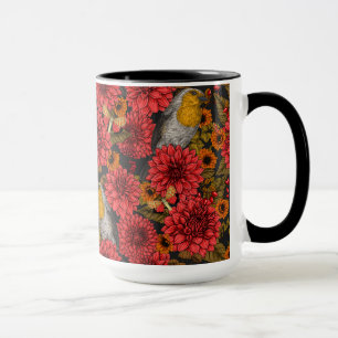 Robins in the autumn garden, red dahlias on black mug