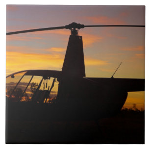 Robinson R44 helicopter at sunset Ceramic Tile