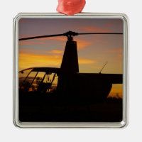 Robinson R44 helicopter at sunset