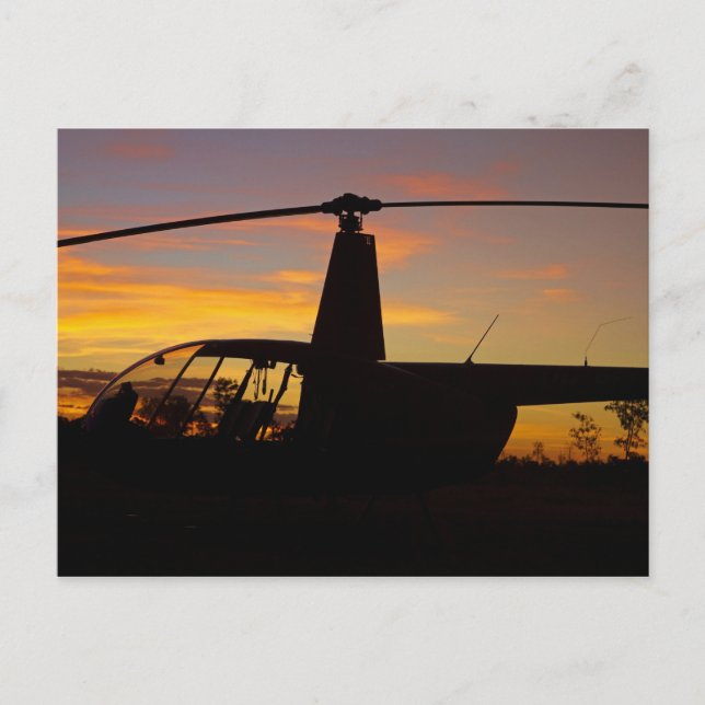 Robinson R44 helicopter at sunset Postcard (Front)