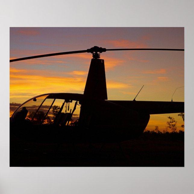 Robinson R44 helicopter at sunset Poster (Front)