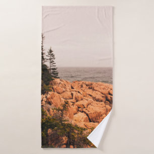 Rocks and trees on the Maine shoreline in Acadia N Bath Towel