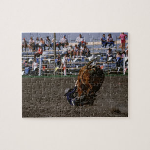 Rodeo rider falling from bull jigsaw puzzle