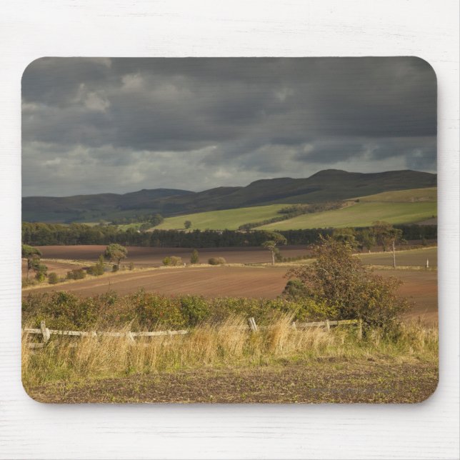 Rolling Hills And Mountains Under A Cloudy Sky Mouse Pad (Front)