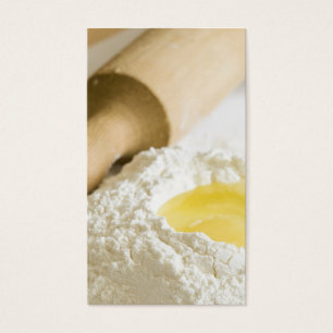 Rolling pin, flour and a broken egg