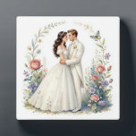 Romantic Bride Groom Floral Elegant Wedding Couple Plaque<br><div class="desc">Romantic watercolor-style bride and groom embracing forehead-to-forehead in elegant off-shoulder wedding gown and tuxedo, framed by delicate floral vines, roses, wildflowers, butterflies and soft pastel garden background. Ethereal, dreamy, vintage-inspired illustration perfect for wedding decor, anniversary gifts, romantic wall art, bridal shower, invitations, canvas prints, posters, t-shirts, mugs, pillows, tote bags...</div>