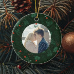 Romantic Christmas Mistletoe Custom Couple Photo Ceramic Ornament<br><div class="desc">This romantic Christmas ornament features your personalised holiday photo with a festive mistletoe and red bow hanging over your custom kissing couple photograph. Add your own newlywed or engagement picture in the centre of this beautiful green botanical holiday pattern. Customise this commemorative keepsake on the back in red and green...</div>