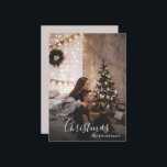 Romantic Cosy Couple Christmas Holiday Photo<br><div class="desc">A romantic Christmas photo card with a modern, cosy style — perfect for couples who love a dark-neutral holiday aesthetic. Soft twinkle lights, a decorated tree, and understated festive accents frame your photo with timeless charm. Replace the sample image with your own favourite portrait, personalise your names and year, and...</div>