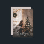 Romantic Cosy Couple Christmas Holiday Photo Card<br><div class="desc">A romantic Christmas photo card with a modern, cosy style — perfect for couples who love a dark-neutral holiday aesthetic. Soft twinkle lights, a decorated tree, and understated festive accents frame your photo with timeless charm. Replace the sample image with your own favourite portrait, personalise your names and year, and...</div>