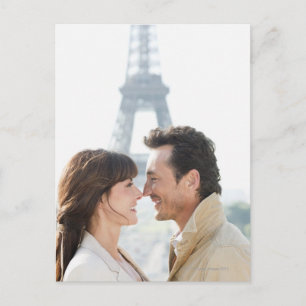 Romantic couple with the Eiffel Tower in the Postcard