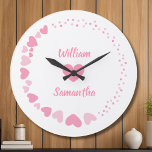 Romantic Heart custom Couple Name Love white  Large Clock<br><div class="desc">Celebrate love every second with this elegant personalised wall clock featuring a romantic design of pink hearts on a black background. The centre showcases two custom names above and below a heart motif, making it perfect for couples, anniversaries, weddings, or Valentine's Day. A thoughtful gift and a stylish addition to...</div>