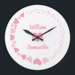 Romantic Heart custom Couple Name Love white  Large Clock<br><div class="desc">Celebrate love every second with this elegant personalised wall clock featuring a romantic design of pink hearts on a black background. The centre showcases two custom names above and below a heart motif, making it perfect for couples, anniversaries, weddings, or Valentine's Day. A thoughtful gift and a stylish addition to...</div>