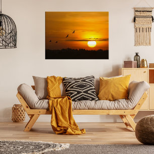 Romantic orange sunset with flying cranes poster