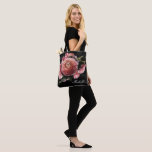 Romantic Pink Floral Bouquet on Black Tote Bag<br><div class="desc">Romantic and moody, this tote bag is the perfect gift for members of your bridal party. The floral design features a natural bouquet of blush pink roses and stunning ranunculus with dark green leaves in a luxurious arrangement on a black watercolor wash. You can personalise with a name and bridal...</div>