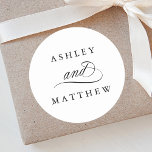 Romantic Swirly Calligraphy Wedding Classic Round Sticker<br><div class="desc">Simple black and white wedding sticker featuring elegant and romantic swirly calligraphy lettering with your names. For more advanced customisation of this design,  please click the BLUE DESIGN TOOL BUTTON above!</div>