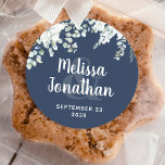 Romantic watercolor floral white flowers wedding  classic round sticker<br><div class="desc">Romantic wedding floral sticker to seal and decorate your wedding invitation envelopes, featuring a delicate watercolor bouquet with white gentle flowers, over greenery, and other botanical foliage, over a classy dark blue background. Easily edit the template fields to add your names and wedding date in a classy white font. View...</div>