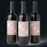 Romantic watercolor white flowers wedding custom wine label<br><div class="desc">Elegant and romantic customisable wine labels for your wedding reception, featuring a beautiful bouquet of white gentle watercolor flowers, over a classy pastel pink background. Easily edit the template fields to add the bride and groom names in a modern white script, and your wedding date in a stylish all-caps font....</div>