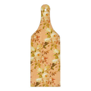 Romantic white roses on orange cutting board