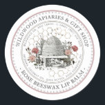 Rose Beeswax Lip Balm Vintage Skep with Honeycomb  Classic Round Sticker<br><div class="desc">Custom Lip Balm label with vintage illustration of a bee-hive surrounded by an old world garden with wildflowers,  roses and little bees. Dotted circle border. Honeycomb Pattern in background. Personalise with your name,  apiary,  location and cell phone,  and ingredient list.</div>