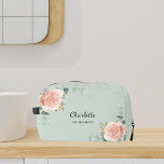 Rose gold floral sage green bridesmaid dopp kit<br><div class="desc">A sage green background. Decorated with watercolored rose gold roses,  eucalyptus greenery and golden sprigs. 
Personalise and add the name of your bridesmaid.</div>