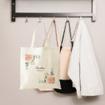 Rose gold floral sage green bridesmaid tote bag<br><div class="desc">A white background.  Decorated with watercolored rose gold roses,  eucalyptus greenery and golden sprigs. 
Personalise and add the name of your bridesmaid. 
Perfect for  the bridesmaid at a bridal shower,  bachelorette weekend.

Back: no design</div>