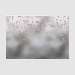 Rose gold glitter confetti on silver tissue paper