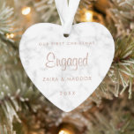 Rose Gold Marble Our First Christmas Engaged Ornament<br><div class="desc">Did you get engaged this year? Add a memory to your tree with this modern and elegant keepsake ornament with the words, "Our First Christmas Engaged" in a faux rose gold script over a grey and white marble background. Use the template to add your names and year. This ornament also...</div>